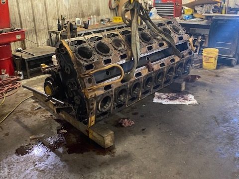 Cat G3516 engine block during teardown on the shop floor
