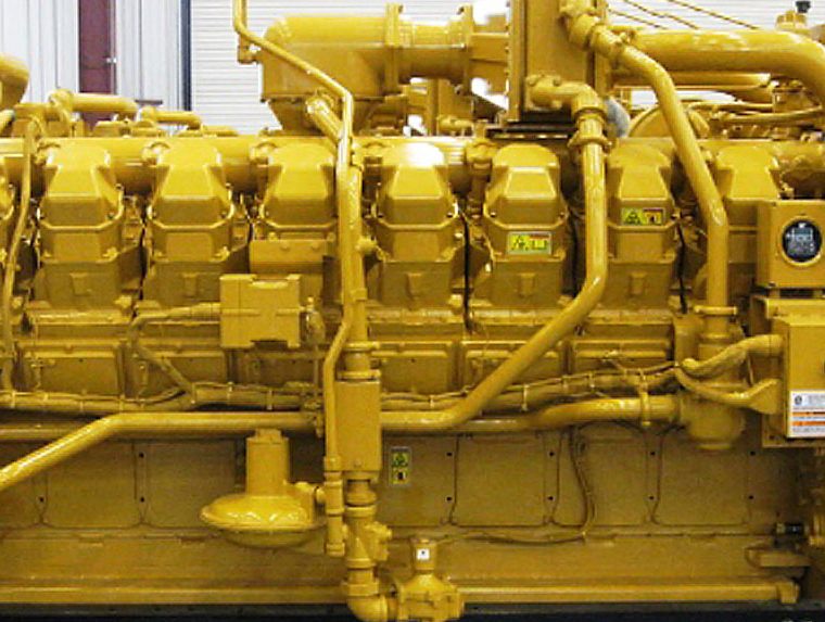 Cylinder heads and turbo plumbing on a rebuilt Caterpillar engine