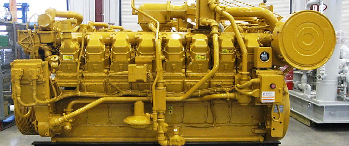 Rebuilt yellow Caterpillar V16 natural gas engine in a shop